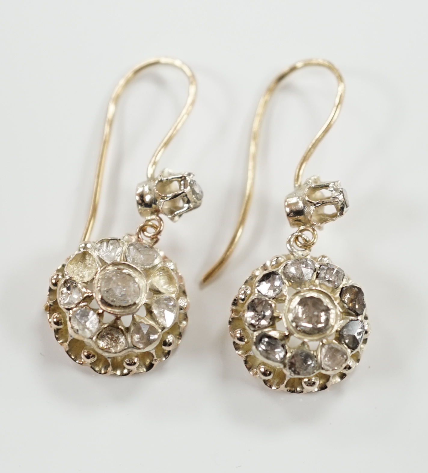 A pair of antique style yellow metal and rose cut diamond cluster set drop earrings, 24mm, gross weight 6.6 grams (stones missing).